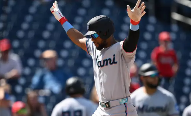 Miami Marlins' Otto Lopez celebrates his two-run home run during the ninth inning of a baseball game against the Washington Nationals, Sunday, Aug. 30, 2026, in Washington. (AP Photo/Nick Wass)