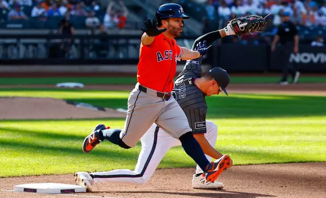 Houston Astros' Jose Altuve reacts after being called out at first base during the fourth inning of a baseball game against the New York Mets, Saturday, Aug. 29, 2026, in New York. (AP Photo/Noah K. Murray)