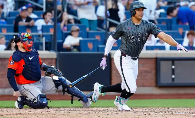New York Mets' Juan Soto runs after hitting an RBI single against the Houston Astros during the fifth inning of a baseball game, Saturday, Aug. 29, 2026, in New York. (AP Photo/Noah K. Murray)