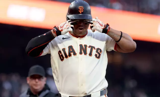 San Francisco Giants' Rafael Devers, gestures after hitting a three-run home run against the Cincinnati Reds during the second inning of a baseball game in San Francisco, Monday, Aug. 24, 2026. (AP Photo/Jed Jacobsohn)