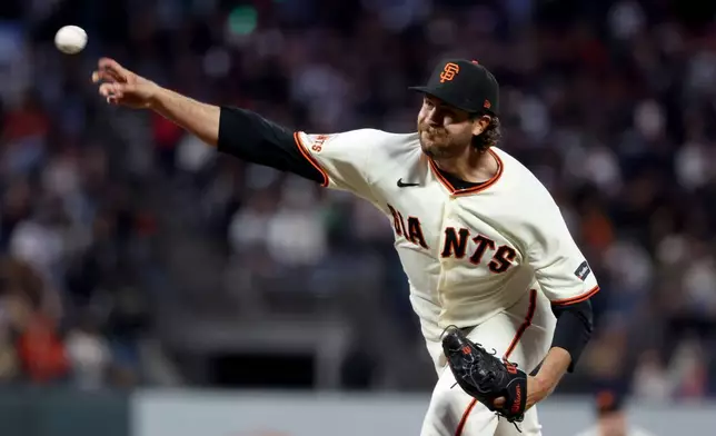 San Francisco Giants pitcher Jason Foley throws against the Cincinnati Reds during the fourth inning of a baseball game in San Francisco, Monday, Aug. 24, 2026. (AP Photo/Jed Jacobsohn)