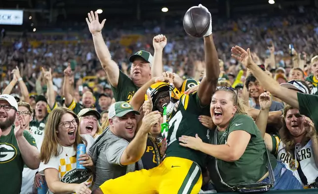 Green Bay Packers' J. Michael Sturdivant reacts after catching a touchdown pass during the first half of a preseason NFL football game against the Arizona Cardinals Friday, Aug. 28, 2026, in Green Bay, Wis. (AP Photo/Abbie Parr)