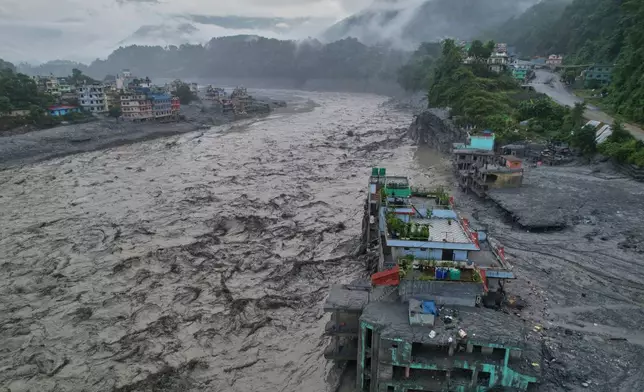 A drone view of the aftermath of flash flooding along the Trishuli river amidst fresh water surge warning in the Trishuli Bazaar area of Nuwakot district, Nepal, Sunday, Aug. 30, 2026. (AP Photo/Rajesh Kumar Singh)