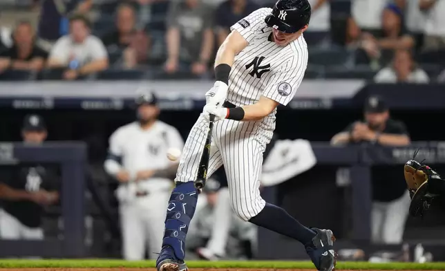 New York Yankees' Ben Rice hits an RBI single during the ninth inning of a baseball game against the Atlanta Braves Friday, Aug. 7, 2026, in New York. (AP Photo/Frank Franklin II)