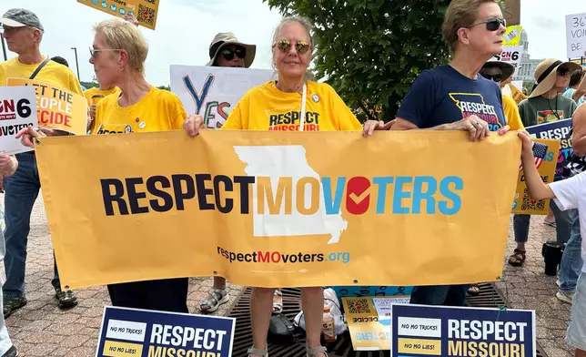 Activists with the group Respect Missouri Voters rally in support of a proposed constitutional amendment near the state Capitol in Jefferson City, Mo., Friday, Aug. 7, 2026. (AP Photo/David A. Lieb)