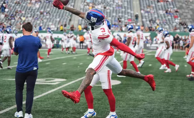 New York Giants wide receiver Odell Beckham Jr. (3) makes a catch while warming up before a preseason NFL football game against the New York Jets, Friday, Aug. 28, 2026, in East Rutherford, N.J. (AP Photo/Frank Franklin II)