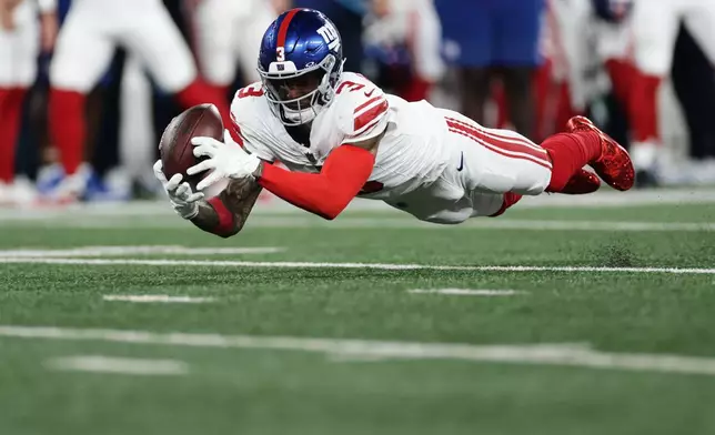 New York Giants wide receiver Odell Beckham Jr. can't make the catch during the first half of a preseason NFL football game against the New York Jets, Friday, Aug. 28, 2026, in East Rutherford, N.J. (AP Photo/Adam Hunger)