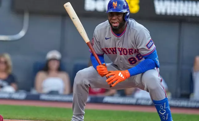 New York Mets' Luis Robert Jr. (88) reacts after a called strike two in the second inning of a baseball game in Cleveland, Tuesday, Aug. 4, 2026. (AP Photo/Sue Ogrocki)