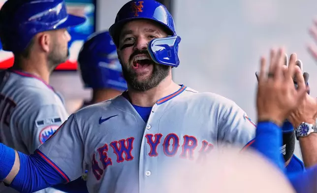 New York Mets' Luis Torrens (13) celebrates his home run in the second inning of a baseball game against the Cleveland Guardians in Cleveland, Tuesday, Aug. 4, 2026. (AP Photo/Sue Ogrocki)