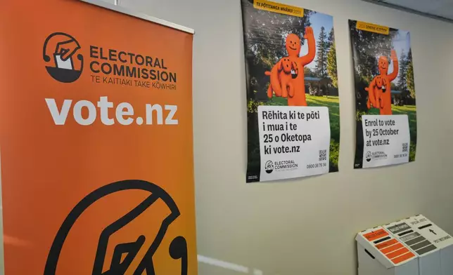 Posters encouraging voters to enrol ahead of New Zealand's elections are seen at the offices of the Electoral Commission in Wellington, New Zealand, Monday, Aug. 10 2026. (AP Photo/Charlotte Graham-McLay)