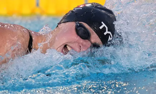 Katie Ledecky, of the United States, competes in the women's 400 meters freestlye final at the Pan Pacific Swimming Championships Friday, Aug. 14, 2026 in Irvine, Calif. (AP Photo/Gregory Bull)