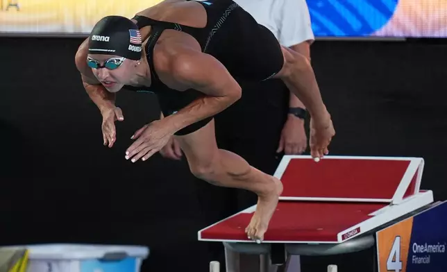 Kate Douglass, of the United States, competes on her way to winning the women's 50 meters freestyle final with a new world record at the Pan Pacific Swimming Championships Saturday, Aug. 15, 2026 in Irvine, Calif. (AP Photo/Gregory Bull)