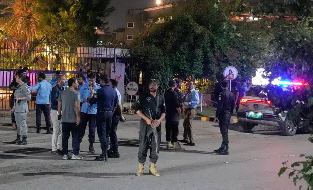 Police officers take a position outside the Shifa International Hospital, where imprisoned former Prime Minister Imran Khan will be transferred for a medical examination following Pakistan's Supreme Court order, in Islamabad, Pakistan, Thursday, Aug. 20, 2026. (AP Photo/Anjum Naveed)