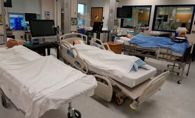 Manikins lay in hospital beds in the simulation lab at Forsyth Technical Community College in Winston-Salem, N.C., Thursday, Aug. 20, 2026. (AP Photo/Chuck Burton)