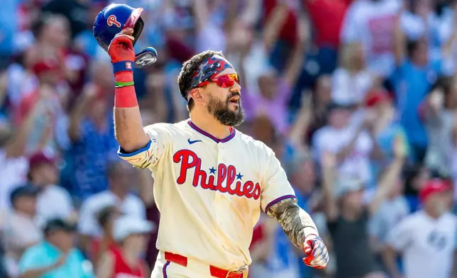 Philadelphia Phillies' Kyle Schwarber gestures after hitting the game winning home run in the ninth inning of a baseball game against the St. Louis Cardinals, Sunday, Aug. 23, 2026, in Philadelphia. (AP Photo/Laurence Kesterson)