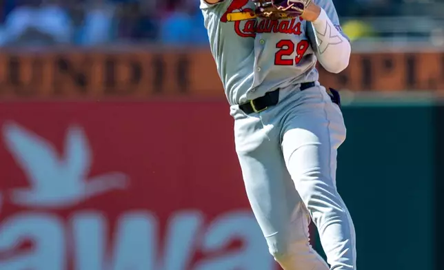 St. Louis Cardinals second baseman Ramon Urias throws to first base for an out against Philadelphia Phillies' Edmundo Sosa in the eighth inning of a baseball game, Sunday, Aug. 23, 2026, in Philadelphia. (AP Photo/Laurence Kesterson)