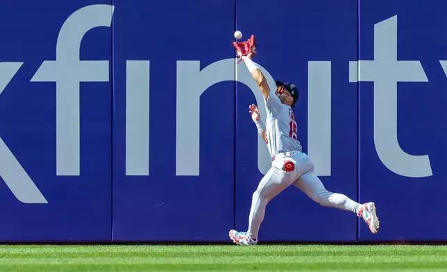 St. Louis Cardinals left fielder José Fermín catches a fly ball hit by Philadelphia Phillies' Bryson Stott in the sixth inning of a baseball game, Sunday, Aug. 23, 2026, in Philadelphia. (AP Photo/Laurence Kesterson)