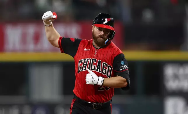 Chicago White Sox's Jake Rogers gestures while running the bases after hitting a walkoff home run during the ninth inning of a baseball game against the New York Mets in Chicago, Friday, Aug. 21, 2026. (AP Photo/Jessie Alcheh)