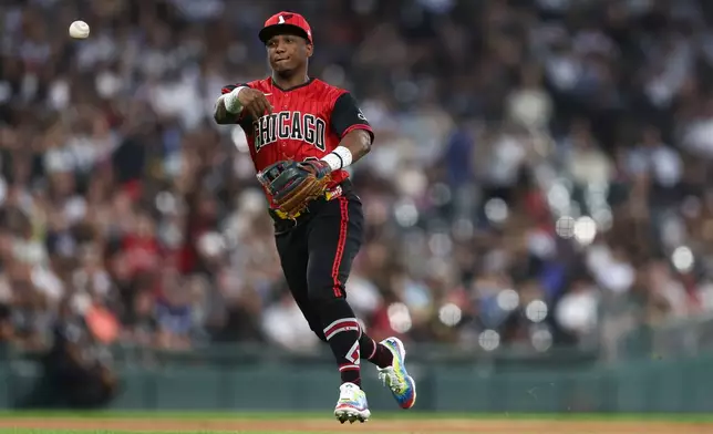 Chicago White Sox shortstop Luisangel Acuña throws to first base during the third inning of a baseball game against the New York Mets in Chicago, Friday, Aug. 21, 2026. (AP Photo/Jessie Alcheh)