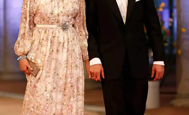 FILE - Norway's Crown Princess Mette-Marit and Crown Prince Haakon arrive for a banquet hosted by the Dutch Royal family at the Rijksmuseum, Amsterdam, The Netherlands, Monday, April 29, 2013. (AP Photo/Daniel Ochoa de Olza, File)