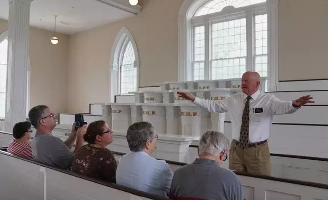 Elder Brian Garner leads a tour of the Kirtland temple site, a nearly two-century old sanctuary considered the first temple in the movement Joseph Smith founded, on Wednesday, June 15, 2026, in Kirtland, Ohio. (AP Photo/Jessie Wardarski)