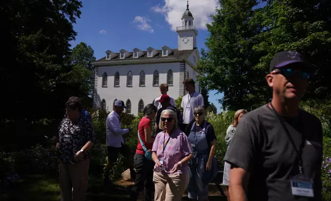 A tour group of Latter-day Saints visits the Kirtland temple site, a nearly two-century old sanctuary considered the first temple in the movement Joseph Smith founded, on Wednesday, June 15, 2026, in Kirtland, Ohio. (AP Photo/Jessie Wardarski)
