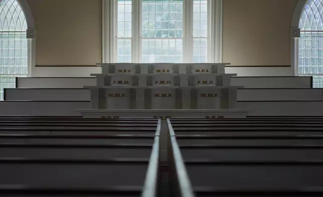 Pew boxes and pulpits in one of two assembly rooms in the Kirtland temple, a nearly two-century old sanctuary considered the first temple in the movement Joseph Smith founded, on Wednesday, June 15, 2026, in Kirtland, Ohio. (AP Photo/Jessie Wardarski)