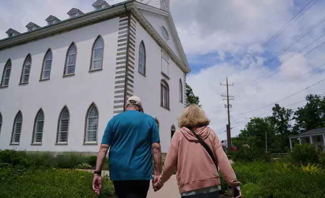 Tourists visit the Kirtland temple site, a nearly two-century old sanctuary considered the first temple in the movement Joseph Smith founded, on Wednesday, June 15, 2026, in Kirtland, Ohio. (AP Photo/Jessie Wardarski)
