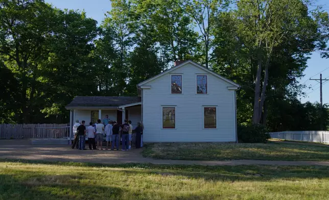 Visitors tour the Joseph and Emma Smith home while at the adjacent Kirtland temple site, on Wednesday, June 15, 2026, in Kirtland, Ohio. (AP Photo/Jessie Wardarski)