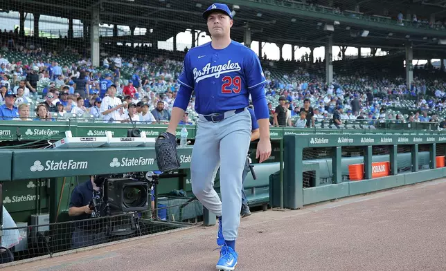 Los Angeles Dodgers starting pitcher Tarik Skubal makes his way to the bullpen prior to a baseball game against the Chicago Cubs, Tuesday, Aug. 4, 2026, in Chicago. (AP Photo/Melissa Tamez)