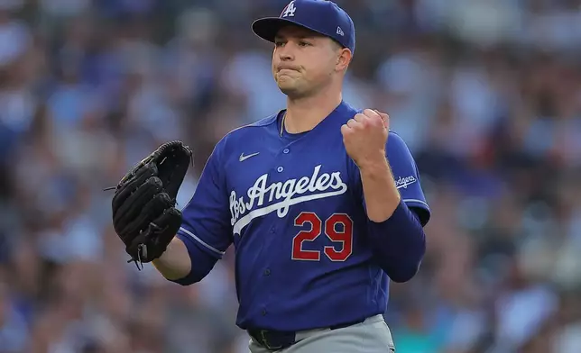 Los Angeles Dodgers' Tarik Skubal celebrates as he walks back to the dugout during the first inning of a baseball game against the Chicago Cubs, Tuesday, Aug. 4, 2026, in Chicago. (AP Photo/Melissa Tamez)
