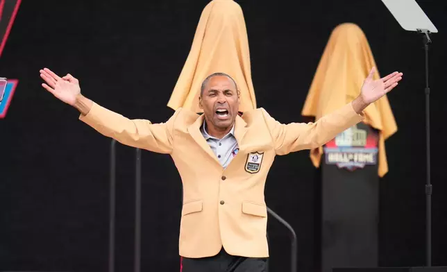 Former NFL player Roger Craig is introduced during the Pro Football Hall of Fame induction ceremony at the Pro Football Hall of Fame, in Canton, Ohio, Saturday, Aug. 8, 2026. (AP Photo/Sue Ogrocki)