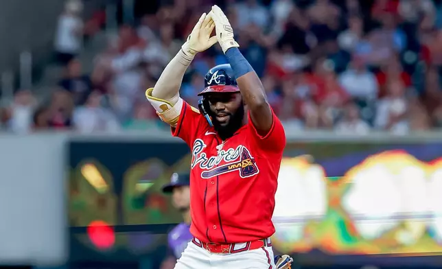 Atlanta Braves' Michael Harris II reacts after hitting an RBI double against the Colorado Rockies during the second inning of a baseball game, Friday, Aug. 28, 2026, in Atlanta. (AP Photo/Erik S. Lesser)