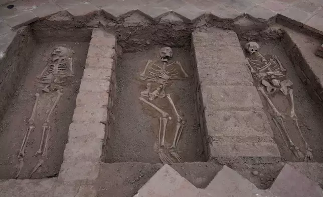Skeletal remains inside the Espiritu Santo Hospital from 1575, according to archeologists from ProLima, are exposed during excavation at the Sanctuary of Santa Rosa de Lima, in Lima, Peru, Tuesday, Aug. 25, 2026. (AP Photo/Martin Mejia)