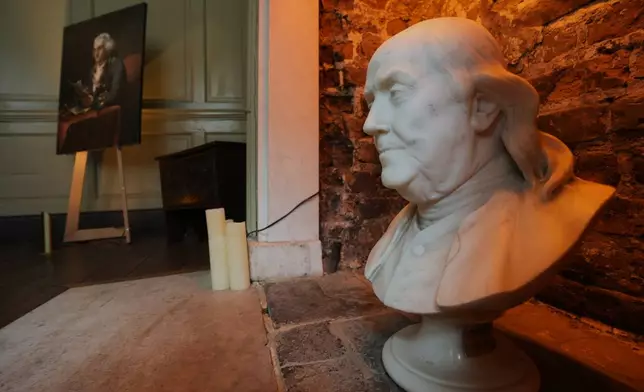 A marble bust and a portrait of Benjamin Franklin is displayed at the Benjamin Franklin House in London, Monday, May 11, 2026. (AP Photo/Kin Cheung)