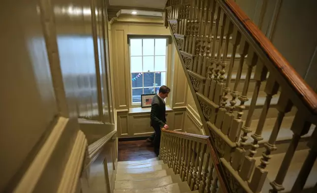 Henry Wilkinson, head of education at the Benjamin Franklin House, walks downstairs at the Benjamin Franklin House in London, Monday, May 11, 2026. (AP Photo/Kin Cheung)