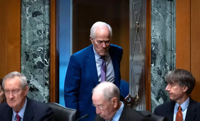 Sen. John Cornyn, R-Texas, arrives for a hearing of the Senate Finance Committee on Capitol Hill, Thursday, July 30, 2026, in Washington. (AP Photo/Mark Schiefelbein)