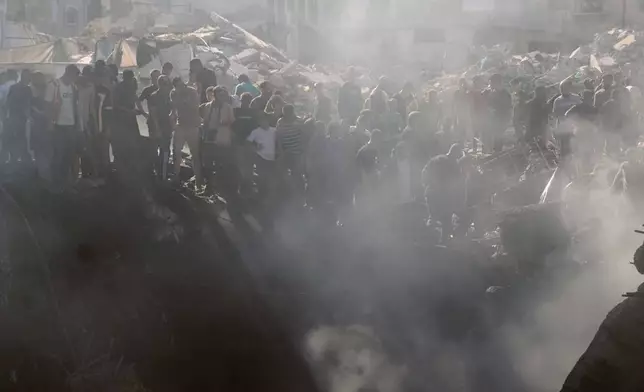 Palestinians inspect the rubble of a building destroyed in an Israeli airstrike in Gaza City, Monday, Aug. 24, 2026. (AP Photo/Jehad Alshrafi)