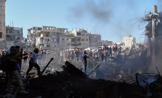 Palestinians inspect the rubble of a building destroyed in an Israeli airstrike in Gaza City, Monday, Aug. 24, 2026. (AP Photo/Jehad Alshrafi)