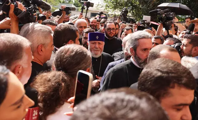 The head of the Armenian Apostolic Church Catholicos Karekin II, center, arrives at the Armavir Court of First Instance in Vagharshapat, Armenia, Friday, Aug. 7, 2026. (AP Photo/Anthony Pizzoferrato)