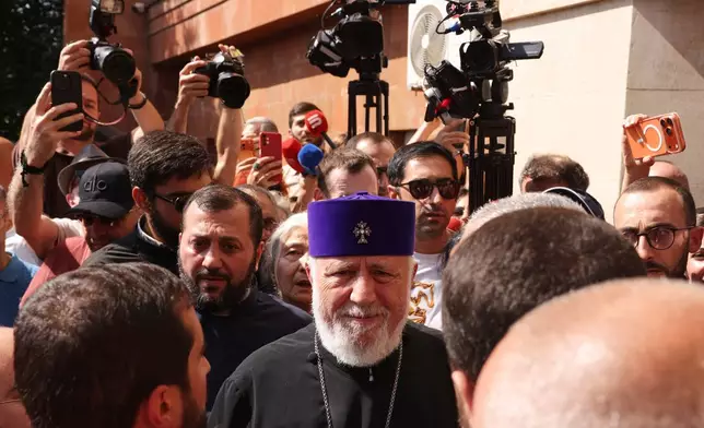 The head of the Armenian Apostolic Church Catholicos Karekin II, center, arrives at the Armavir Court of First Instance in Vagharshapat, Armenia, Friday, Aug. 7, 2026. (AP Photo/Anthony Pizzoferrato)