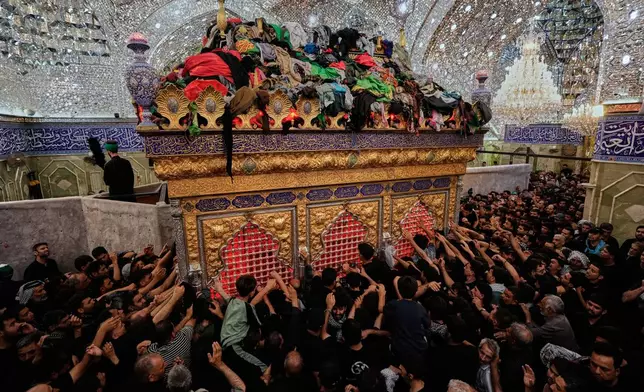 Shiite Muslim worshippers gather inside the holy shrine of Imam Abbas ahead of the Arbaeen festival in Karbala, Iraq, Sunday, Aug. 2, 2026.(AP Photo/Hadi Mizban)