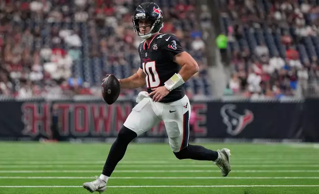 Houston Texans quarterback Davis Mills (10) scramble against the Los Angeles Chargers during the first half of an NFL preseason football game Thursday, Aug. 13, 2026, in Houston. (AP Photo/Ashley Landis)