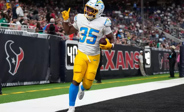 Los Angeles Chargers running back Amar Johnson (35) celebrates a two-point conversion against the Houston Texans during the second half of an NFL preseason football game Thursday, Aug. 13, 2026, in Houston. (AP Photo/Ashley Landis)