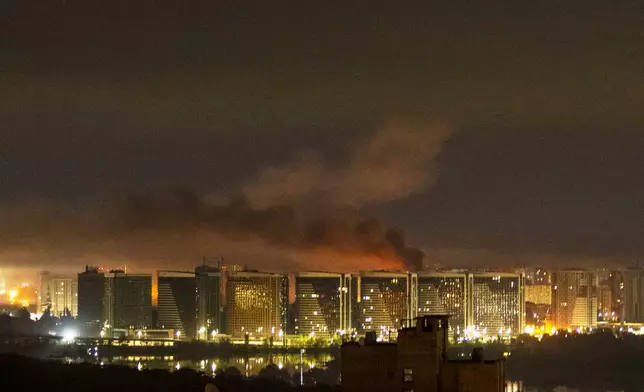 Smoke rises over the city center of Kyiv, Ukraine, after a Russian missile attack Saturday, Aug. 1, 2026. (AP Photo/Dan Bashakov)