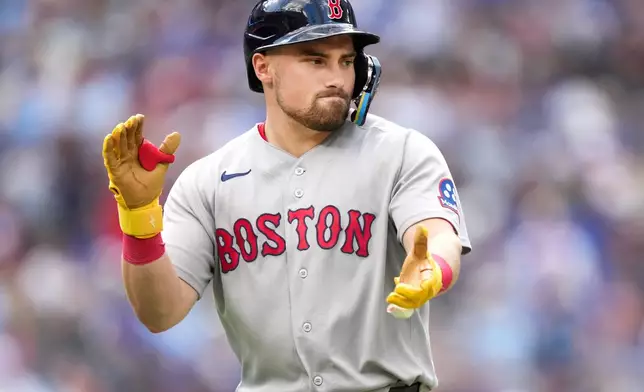 Boston Red Sox third baseman Caleb Durbin (5) reacts after hitting a grand slam against the Toronto Blue Jays during the eighth inning of a baseball game in Toronto, Thursday, Aug. 13, 2026. (Nathan Denette/The Canadian Press via AP)