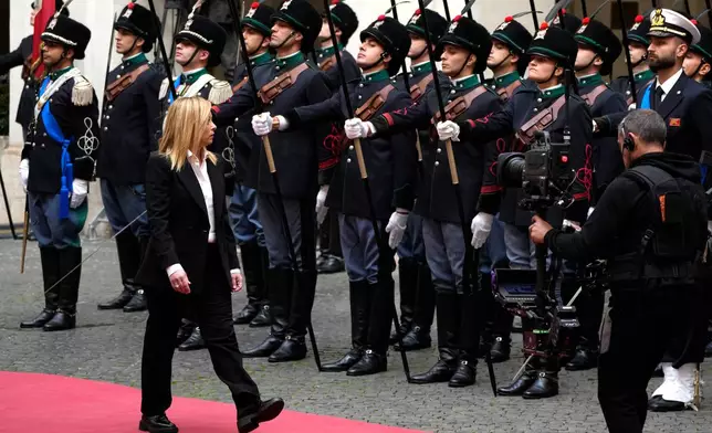 FILE - New Italian Premier Giorgia Meloni arrives for the handover ceremony at Chigi Palace Premier's office, in Rome, Sunday, Oct. 23, 2022. (AP Photo/Alessandra Tarantino, File)