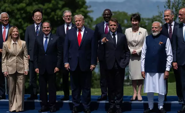 FILE - Italian Prime Minister Giorgia Meloni (front, left) gathers with other world leaders for a group photo at the G7 summit, Tuesday, June 16, 2026, in Evian-les-Bains, France. (AP Photo/Julia Demaree Nikhinson, File)
