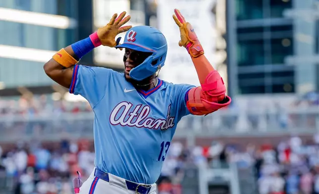 Atlanta Braves right fielder Ronald Acuña Jr. (13) reacts while rounding the bases after hitting a solo home run against the Arizona Diamondbacks during the first inning of a baseball game, Saturday, August 15, 2026, in Atlanta. (AP Photo/Erik S. Lesser)