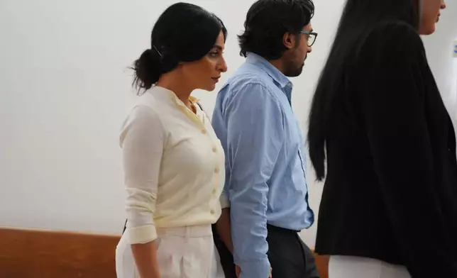 Nausheen Gilkar, left, and her husband Omar Ahmed arrive for a court hearing in Dallas, Tuesday, Aug. 25, 2026. (AP Photo/LM Otero)